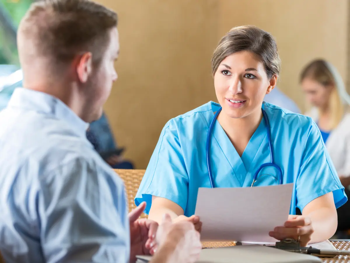 Nurse Consulting with a Patient